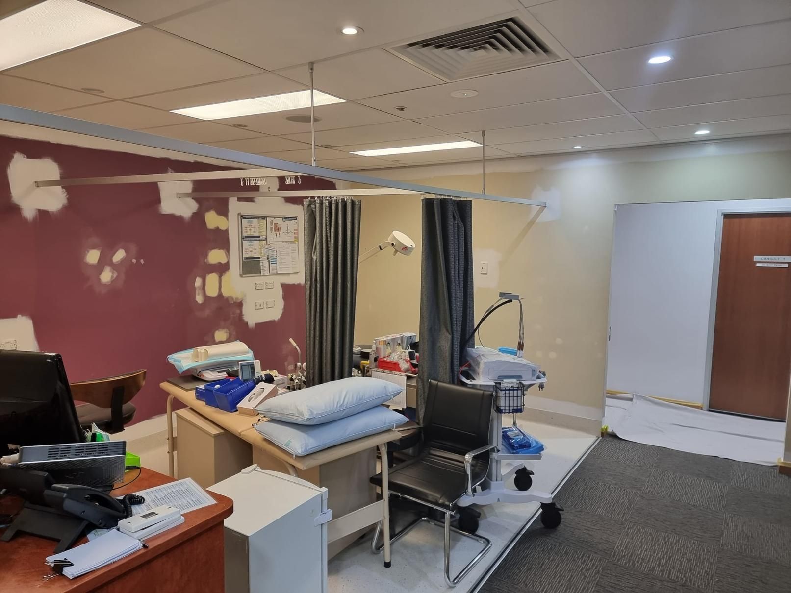 A Hospital Room With A Bed, Chair, Desk And Computer — LMS Painting & Maintenance Pty Ltd In North Lambton, NSW