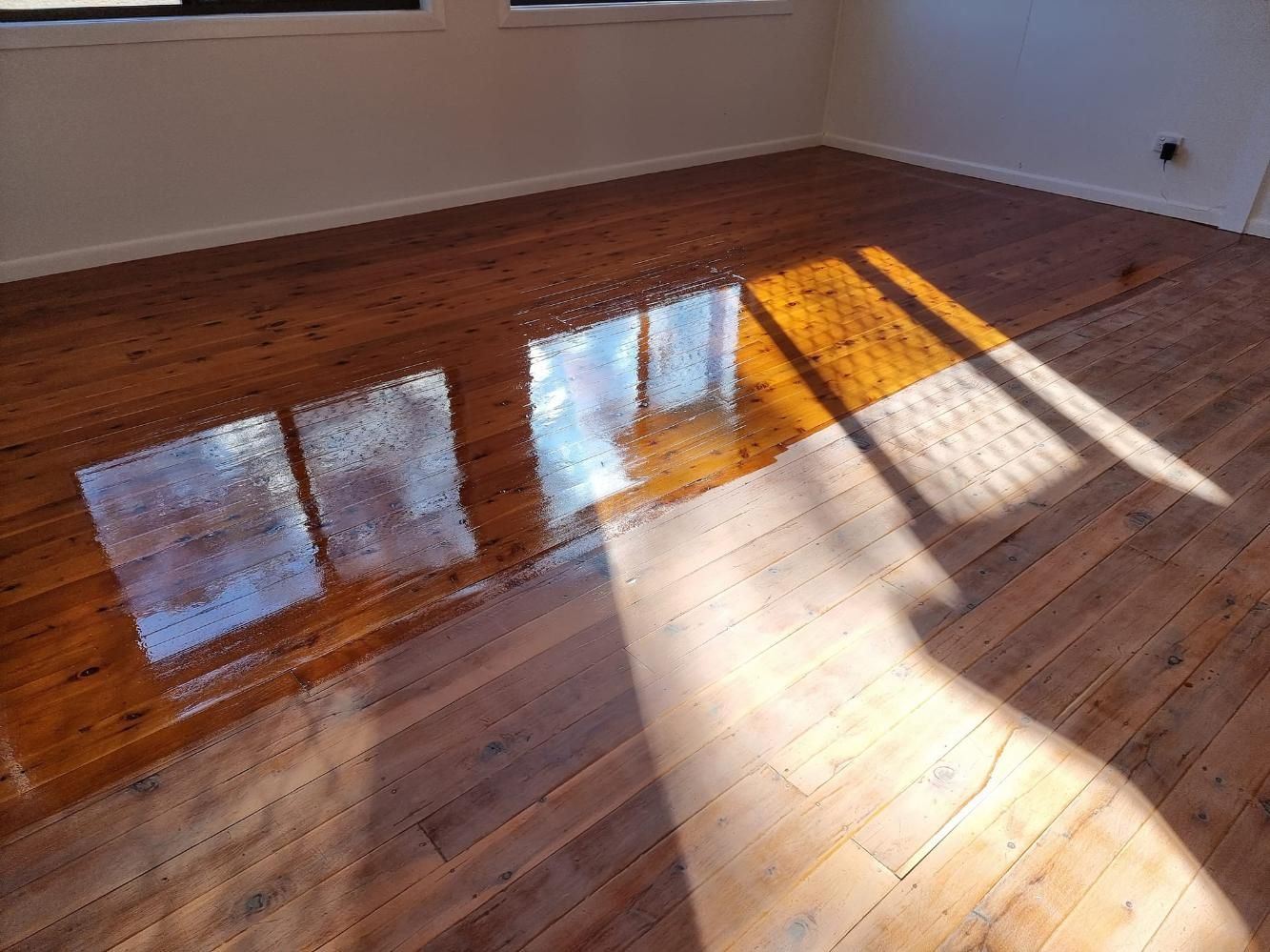 The Sun Is Shining Through The Windows On A Wooden Floor — LMS Painting & Maintenance Pty Ltd In Singleton, NSW