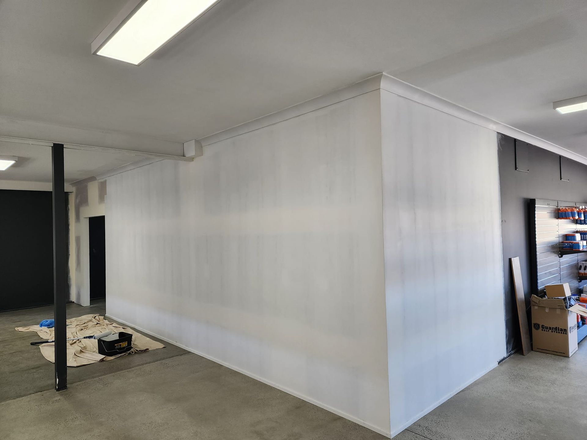 There Is A Large White Wall In The Middle Of A Room — LMS Painting & Maintenance Pty Ltd In North Lambton, NSW