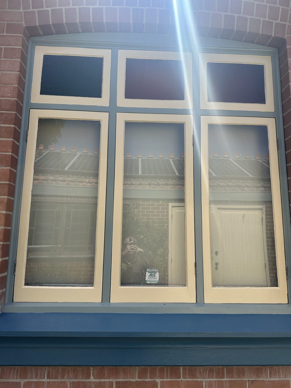 A brick building with three windows and a door — LMS Painting & Maintenance Pty Ltd In North Lambton, NSW
