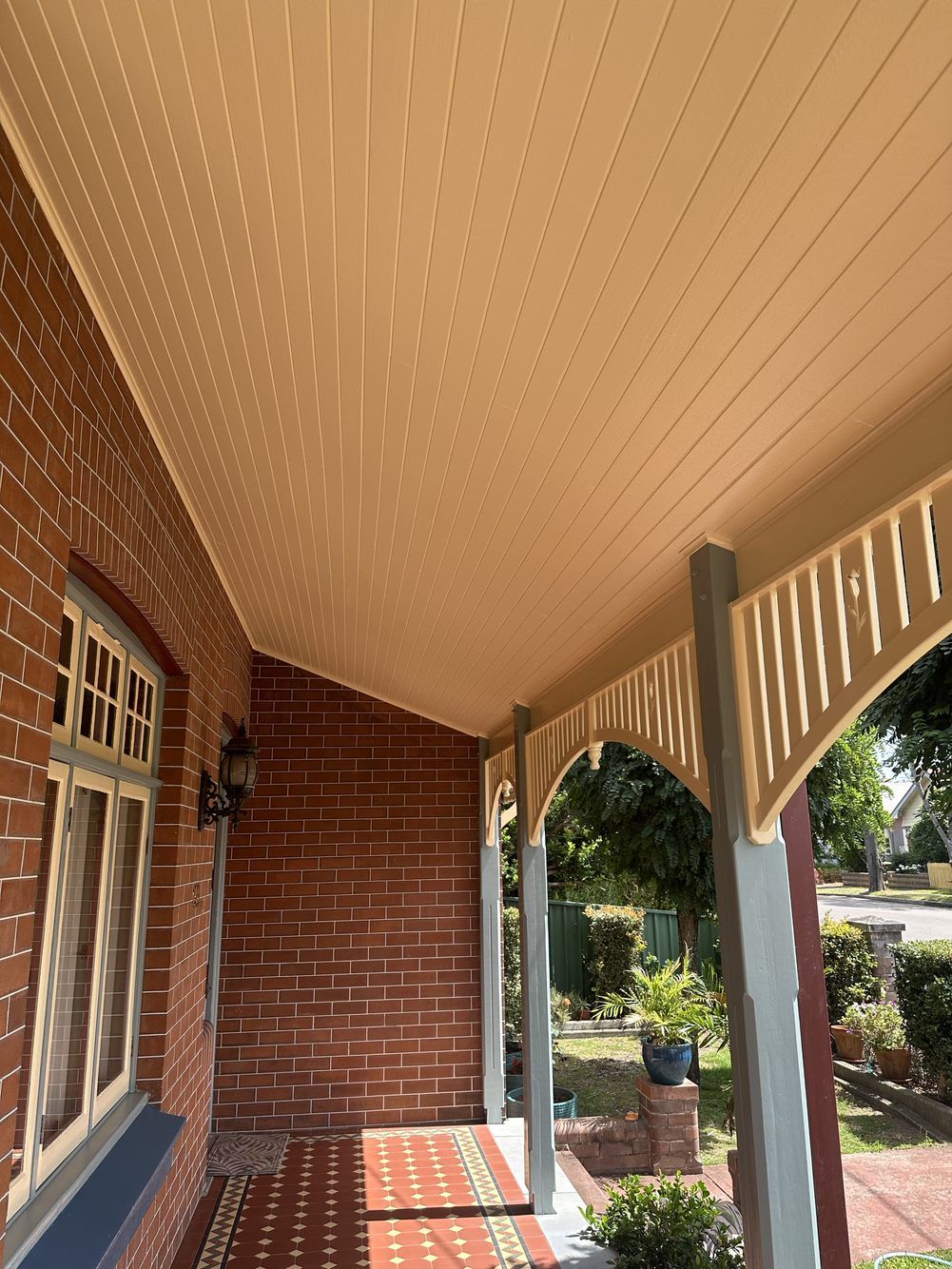 A brick house with a porch and a white ceiling — LMS Painting & Maintenance Pty Ltd In North Lambton, NSW