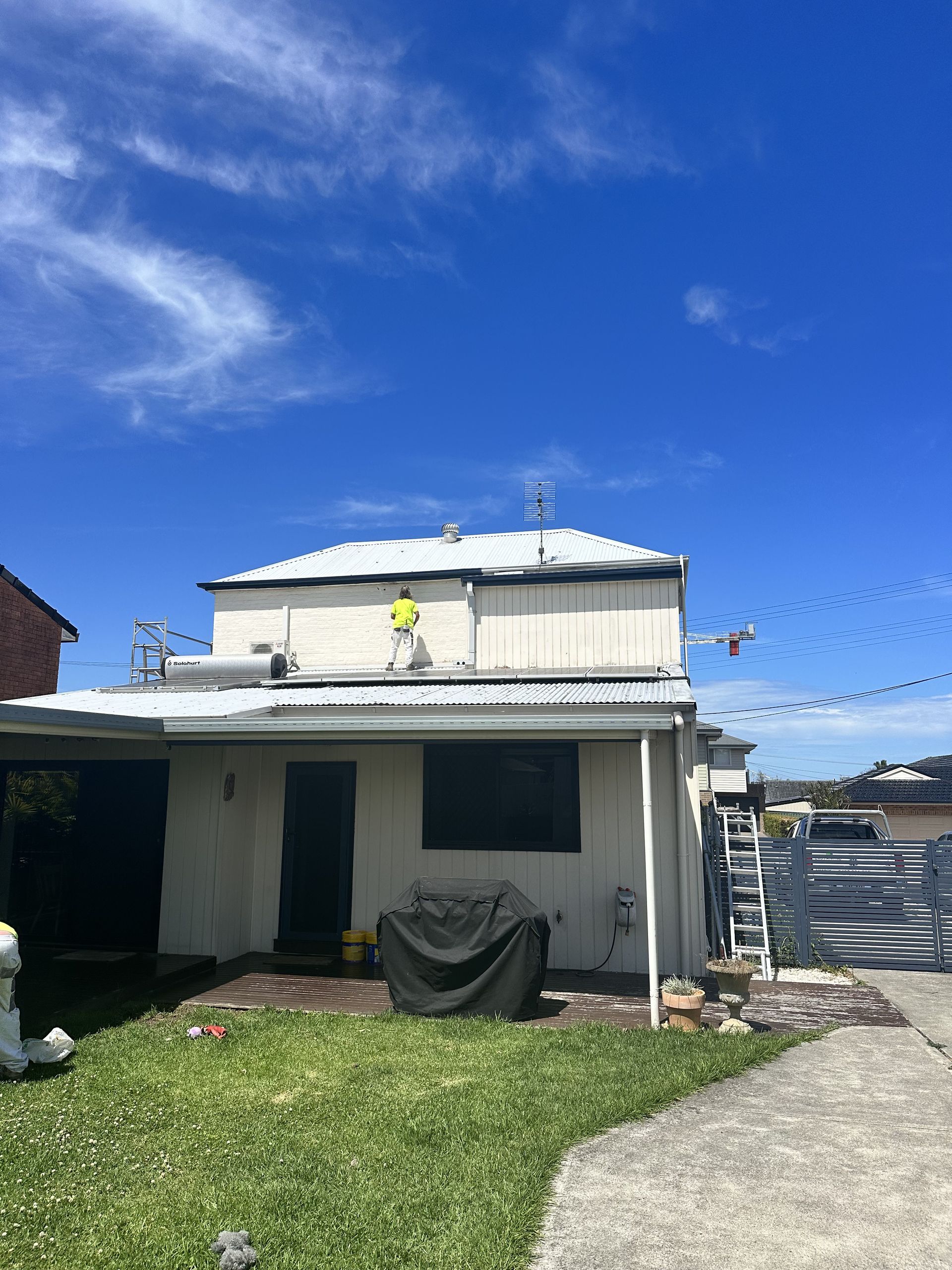 A white house being painted  — LMS Painting & Maintenance Pty Ltd In North Lambton, NSW