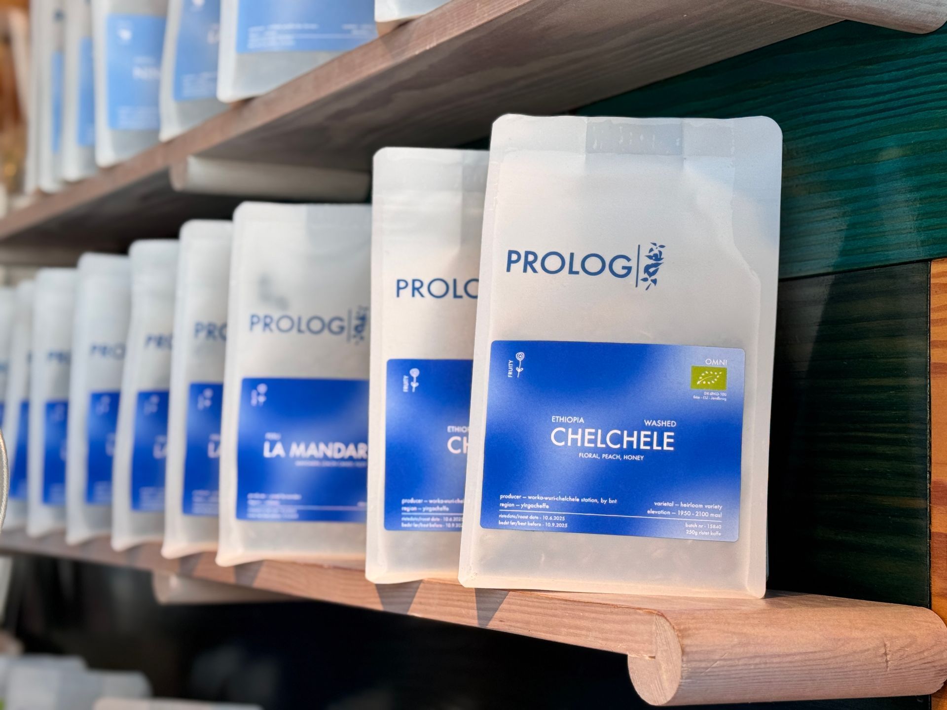 Bags of coffee on a shelf, labeled