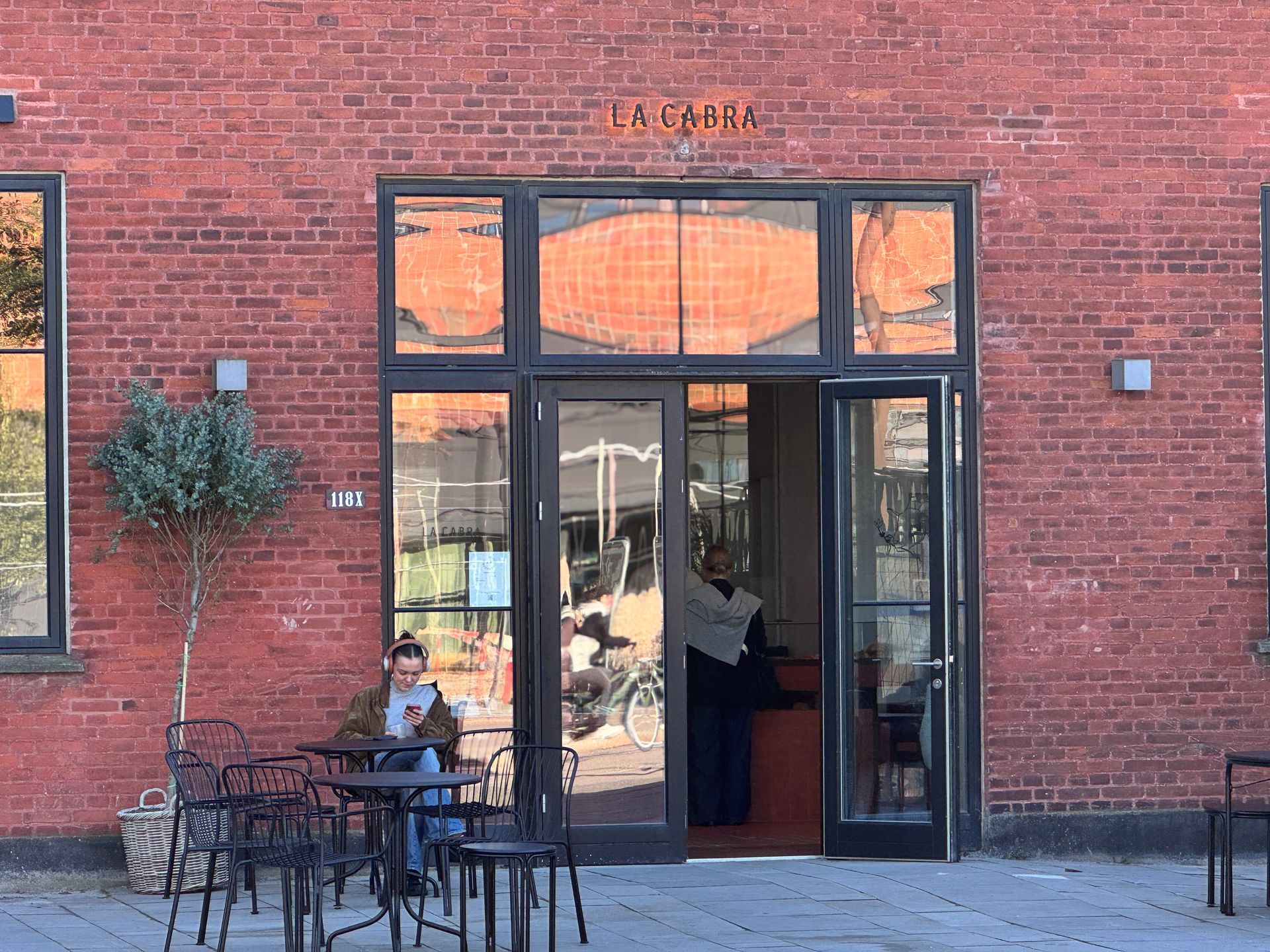 Red brick building with glass door, 