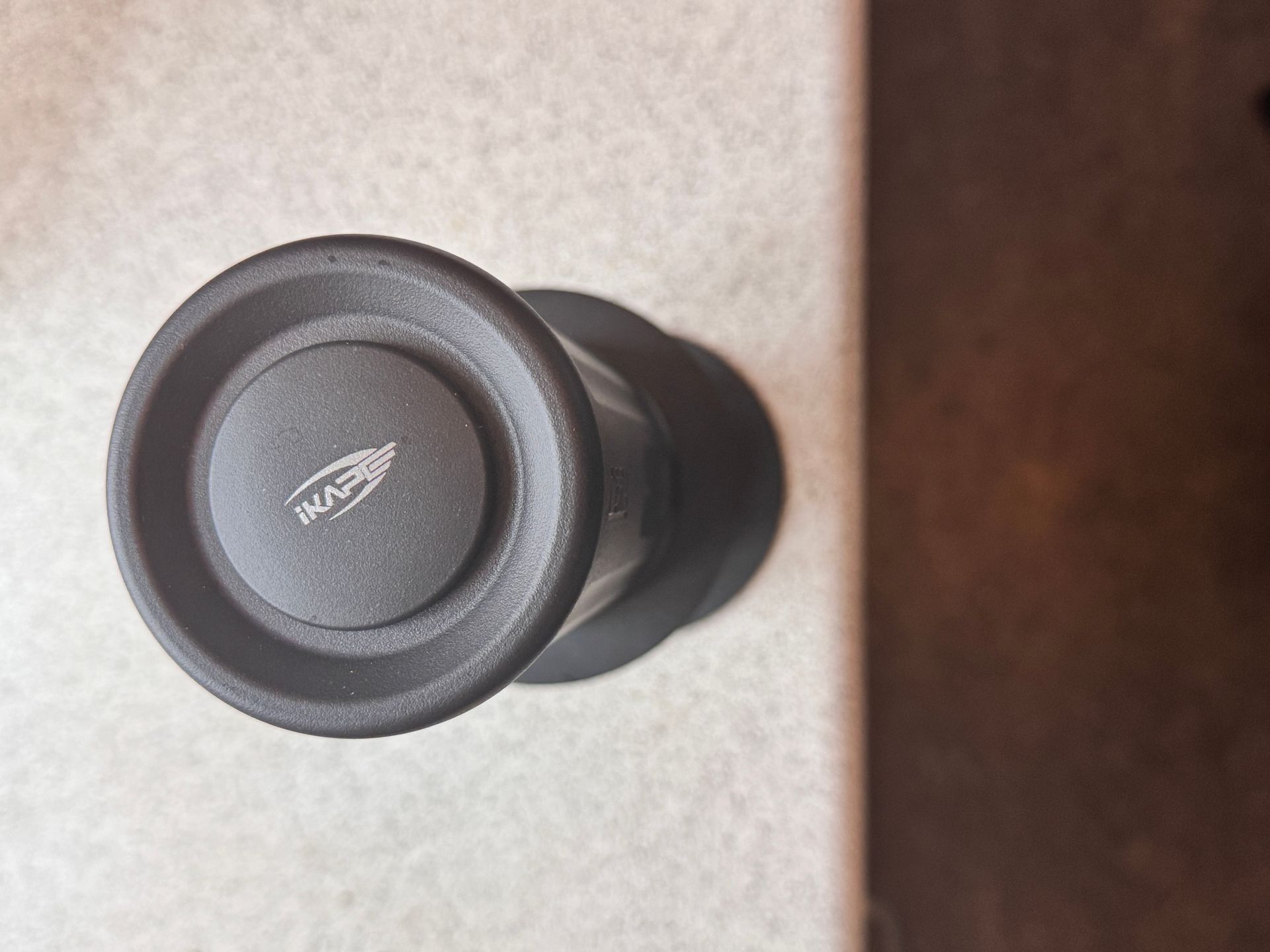 Black object with raised rim and 
