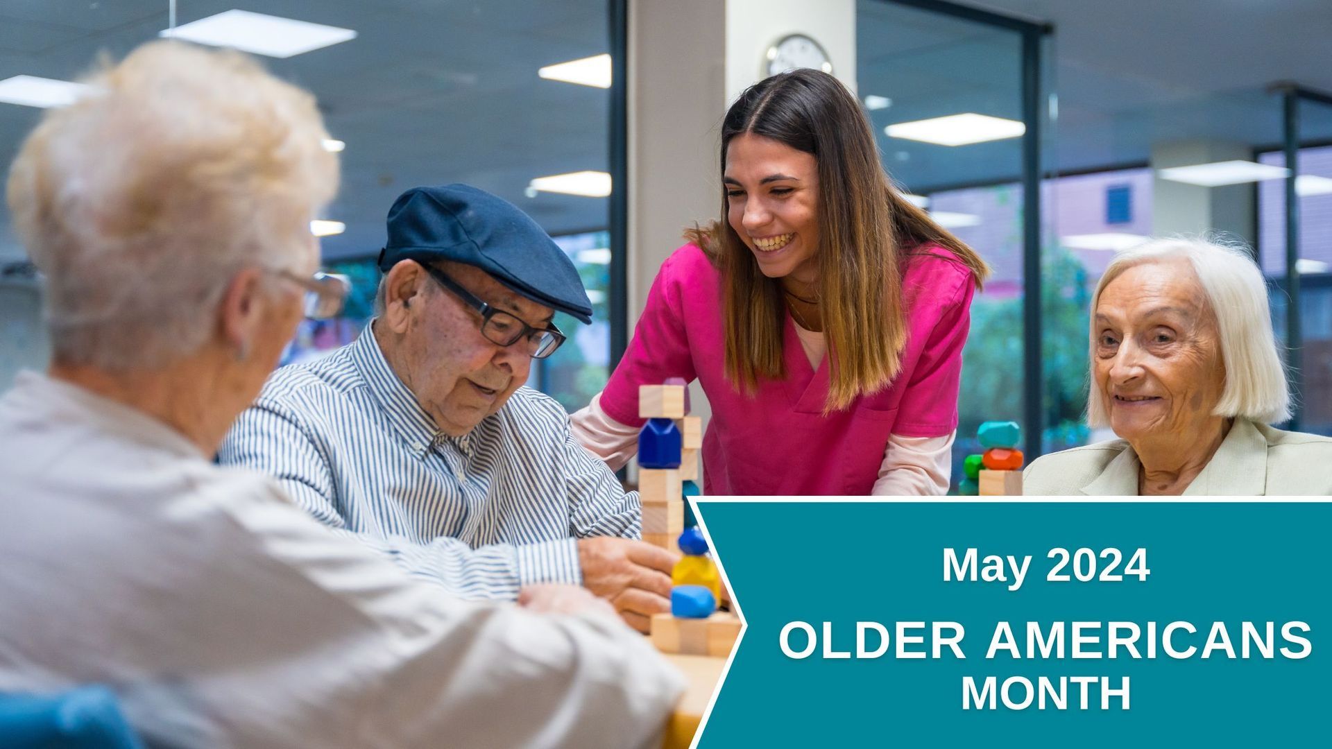 A group of elderly people are sitting around a table with a nurse.