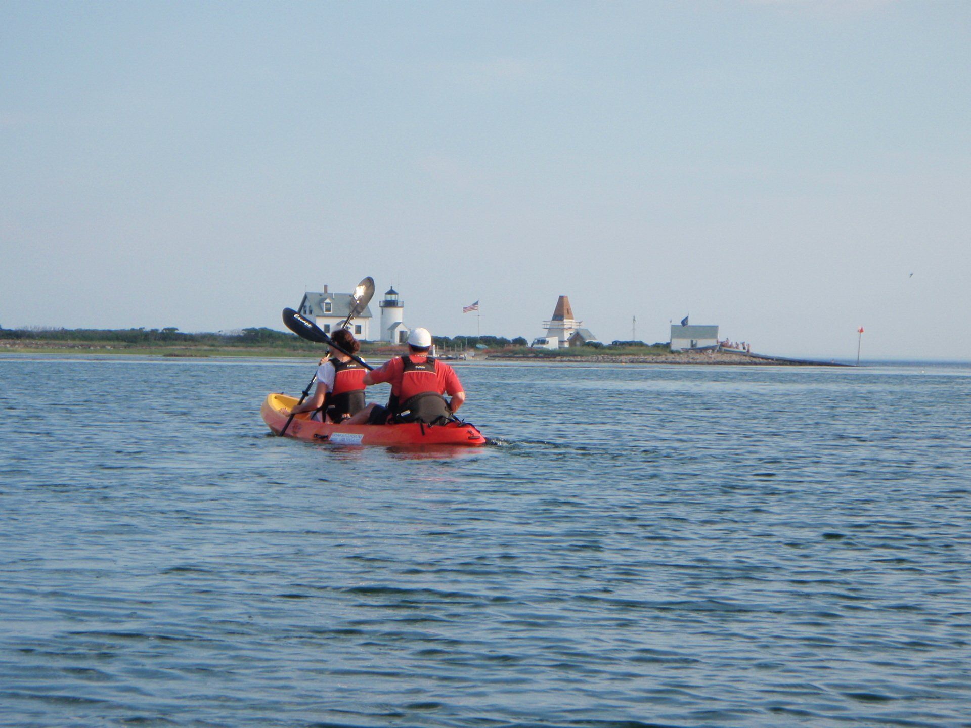 Man and woman on the middle of Maine while on tandem kayak