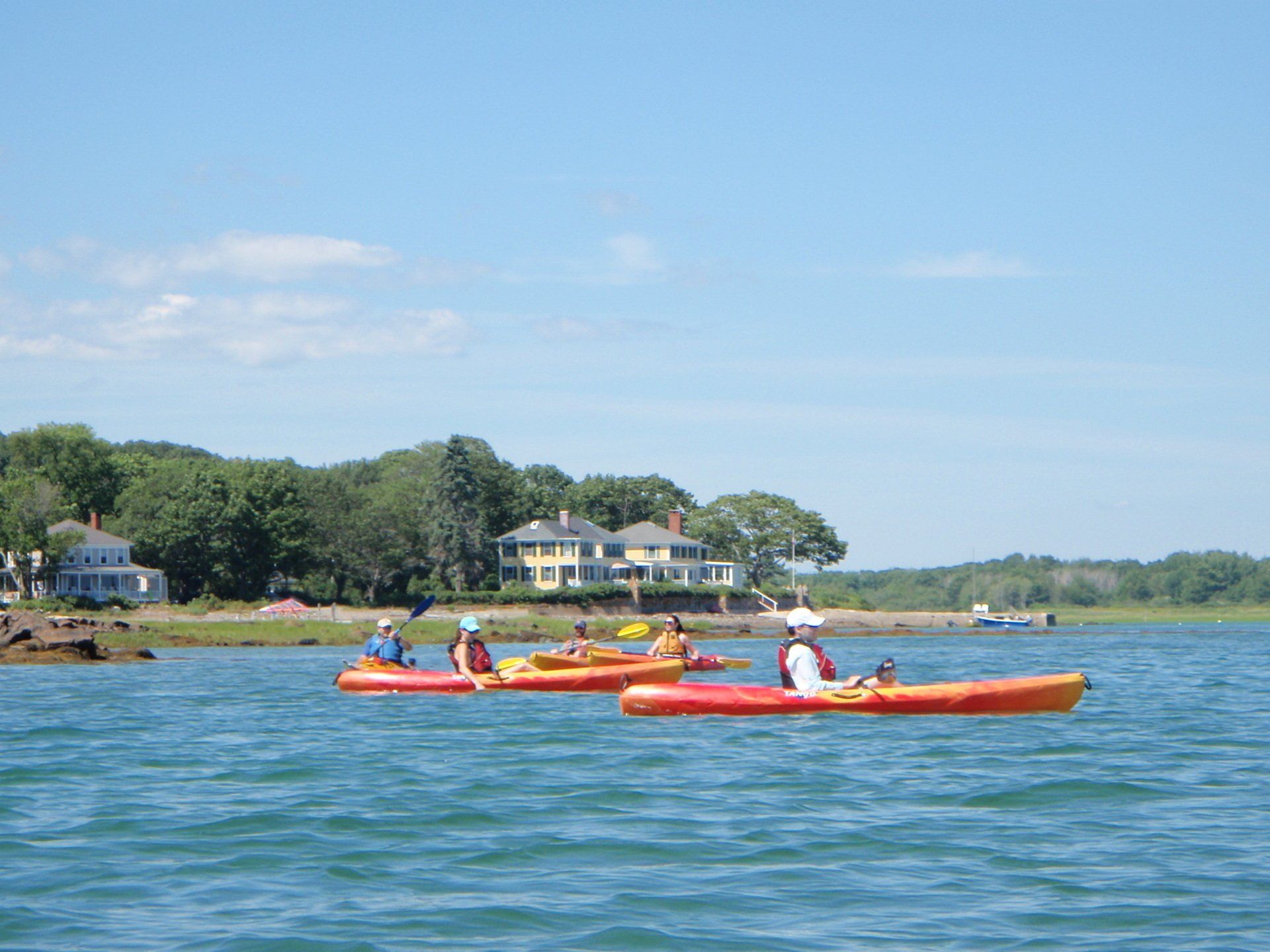 Group of people on the middle of the Maine while kayaking