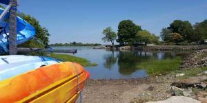 Red orange kayak on the shore