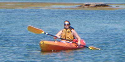 Woman on the middle of the Maine while on kayak