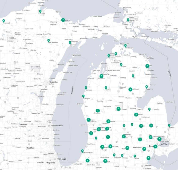 Map of Michigan with many green location pins across the state, including the Upper and Lower Peninsulas