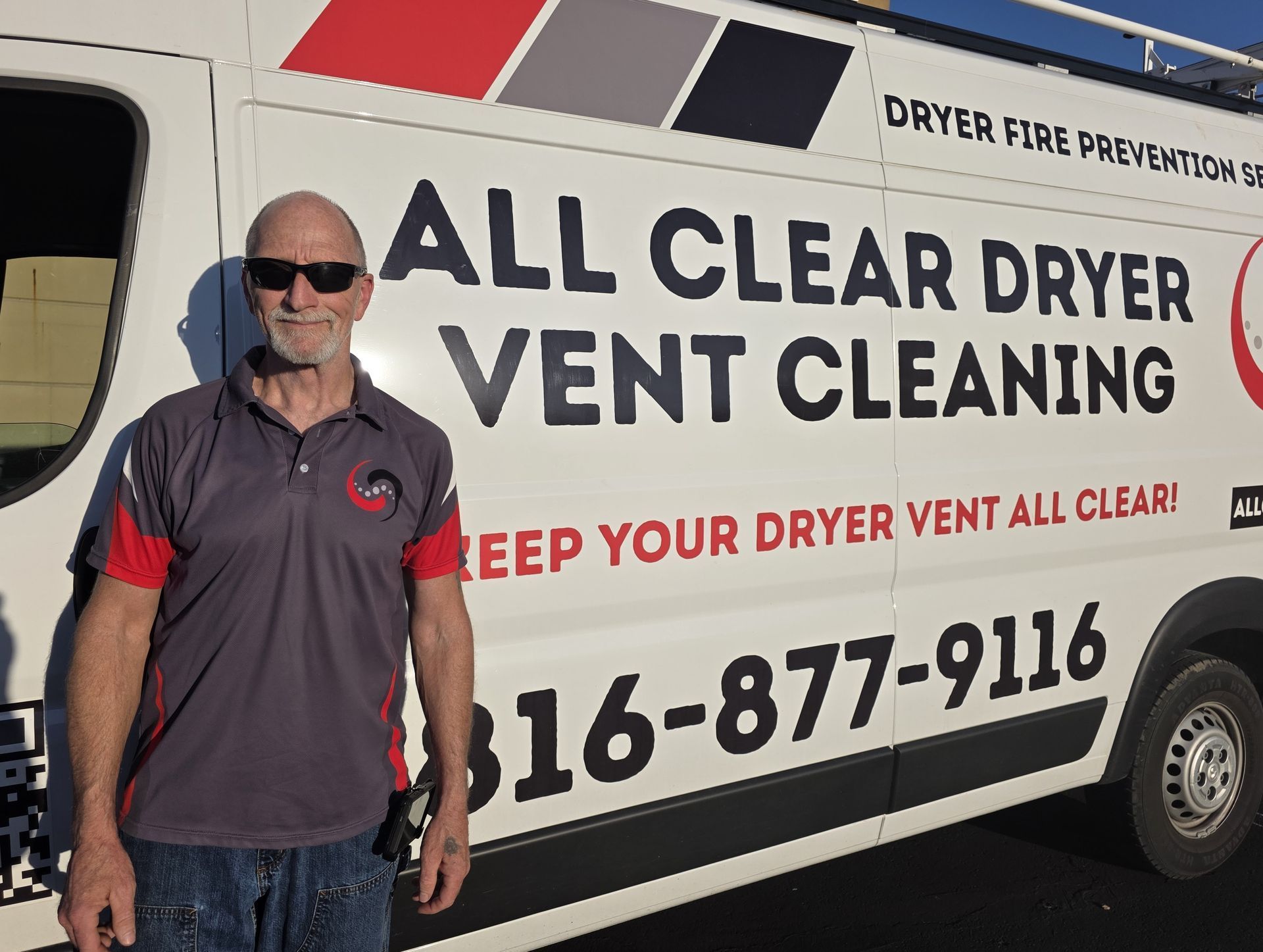 Man standing beside All Clear Dryer Vent Cleaning service van with large company logo and phone number