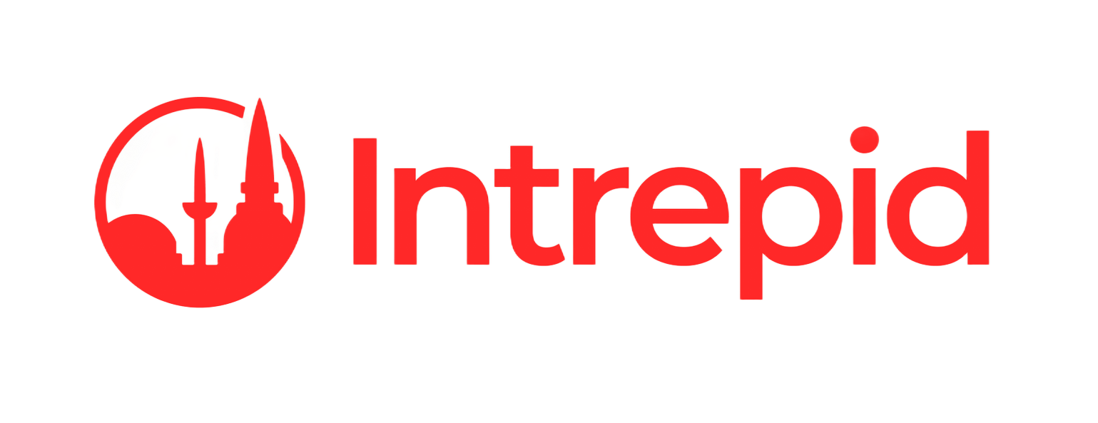 A red logo consisting of a circular icon depicting stylized buildings next to the word