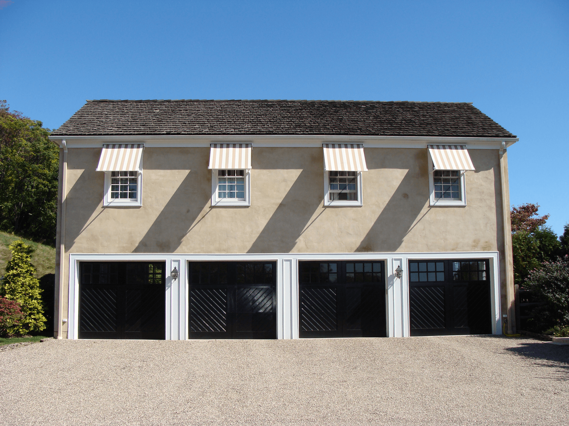 awnings over individual windows over garage doors
