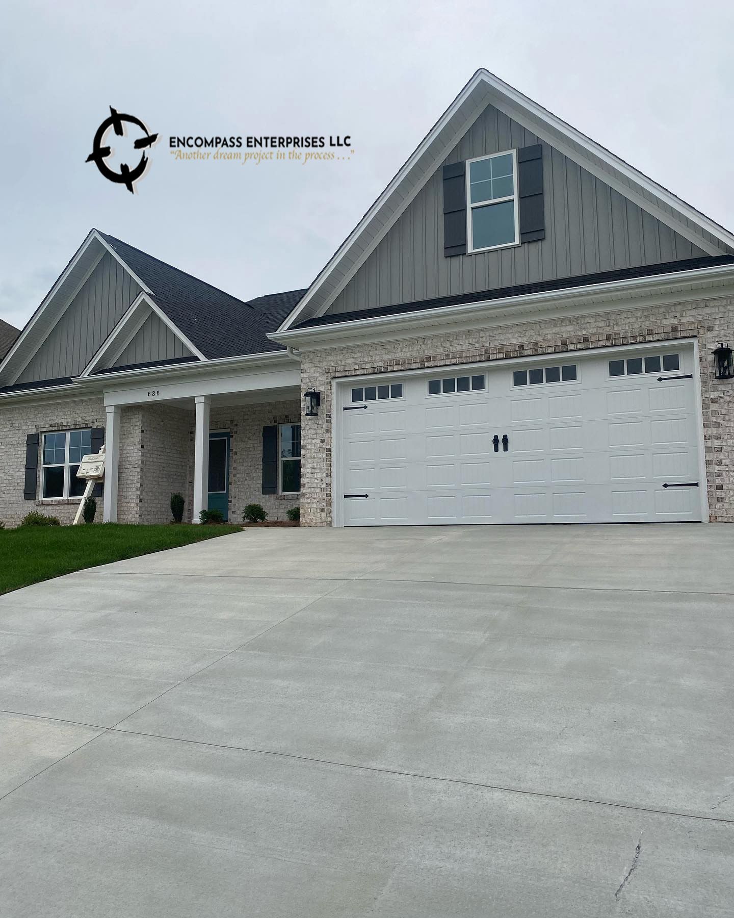 modern home with large 2 car garage door, overhead door