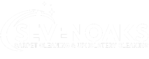 A white logo with a rainbow in the middle of it on a white background.