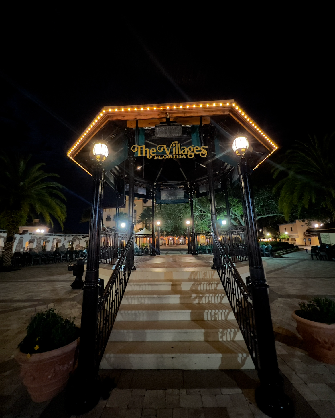 An illuminated gazebo with a 