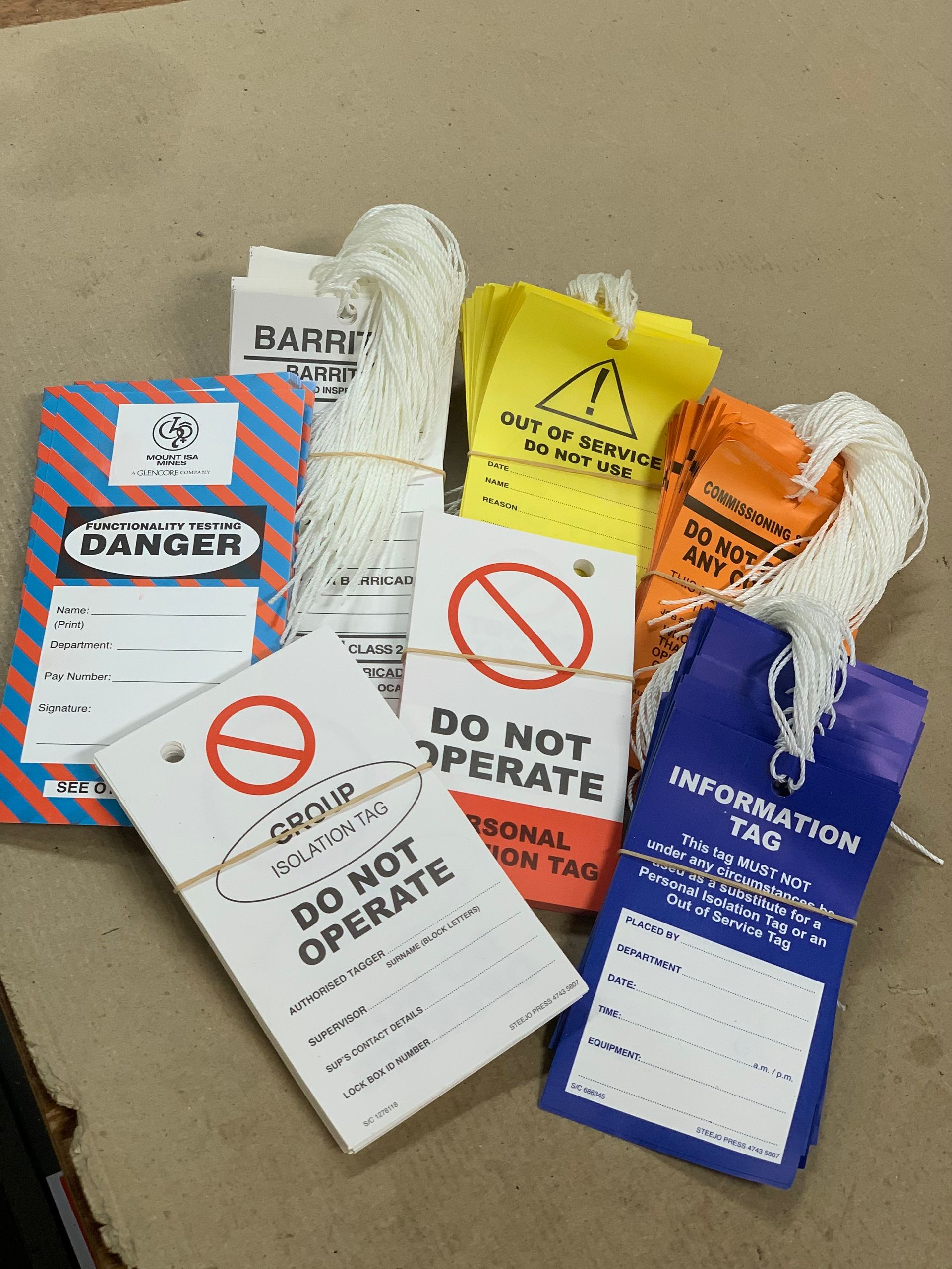 A Bunch Of Tags Including One That Says Do Not Operate — Steejo Press in The Gap, QLD