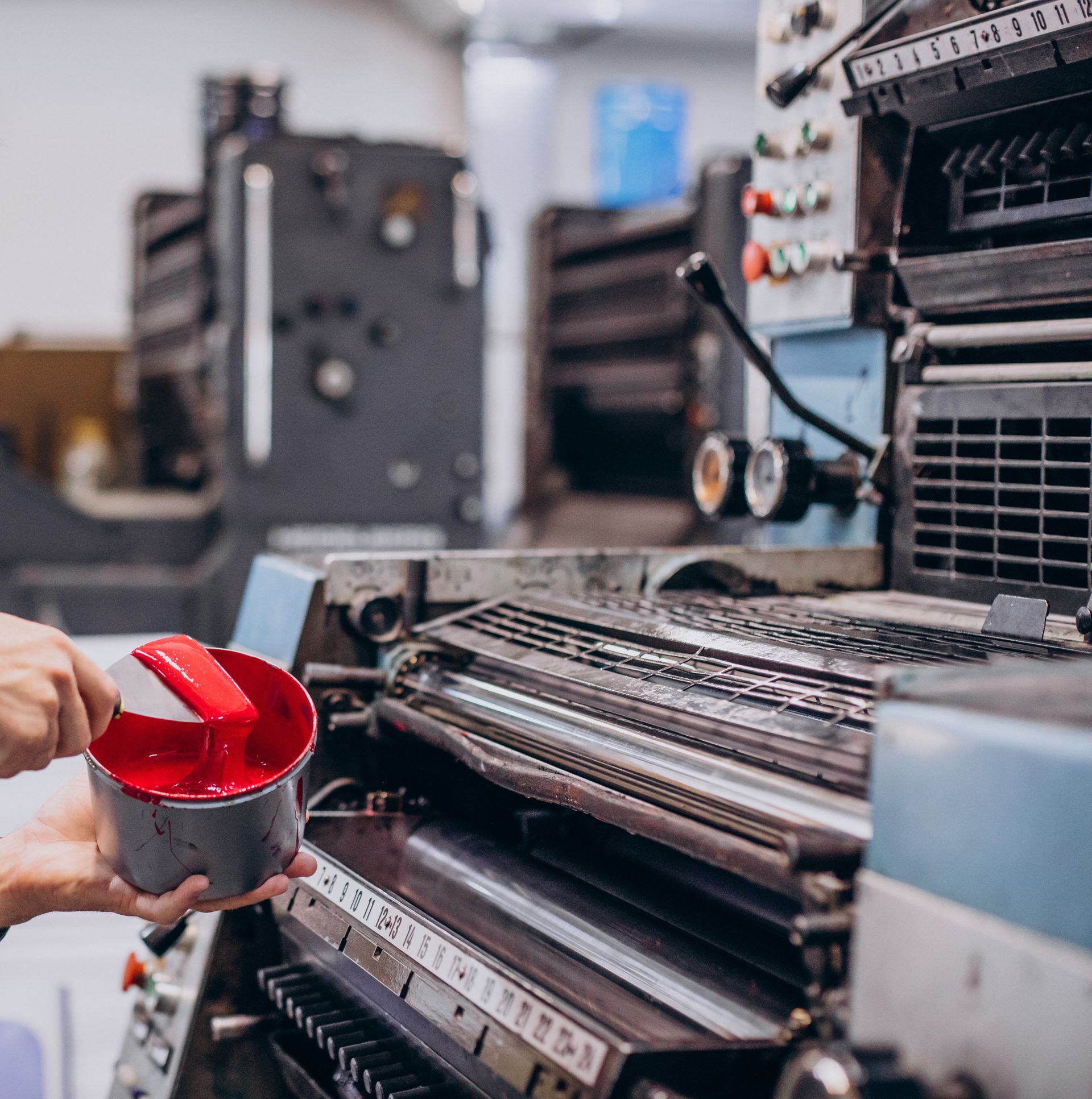 Man Working Printing House Wit Paper Paints — Steejo Press in The Gap, QLD