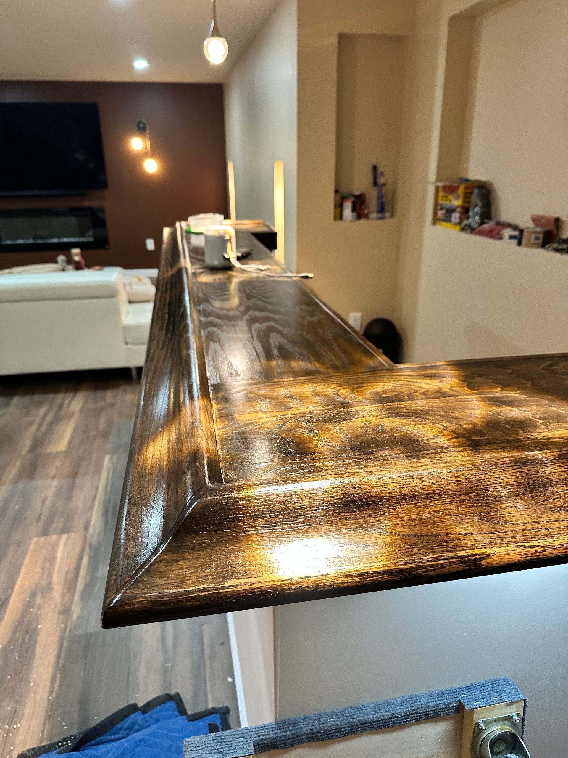 Close view along a glossy counter with dramatic gold and dark marbled patterns
