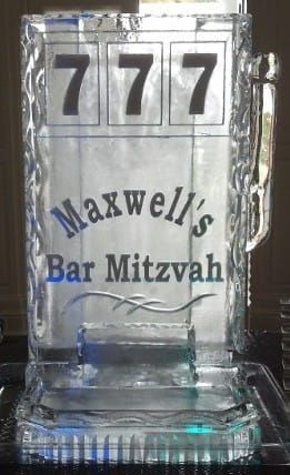 Clear acrylic “Maxwell’s Bar Mitzvah” sign with three 7s on top and blue accents
