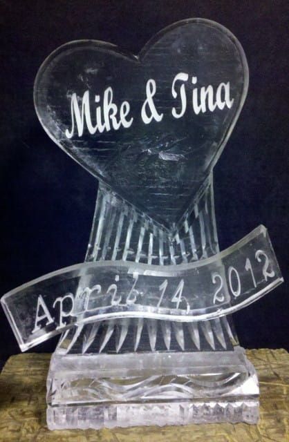 Engraved clear glass keepsake with heart top reading “Mike & Tina” and ribbon date “April 14 2012”