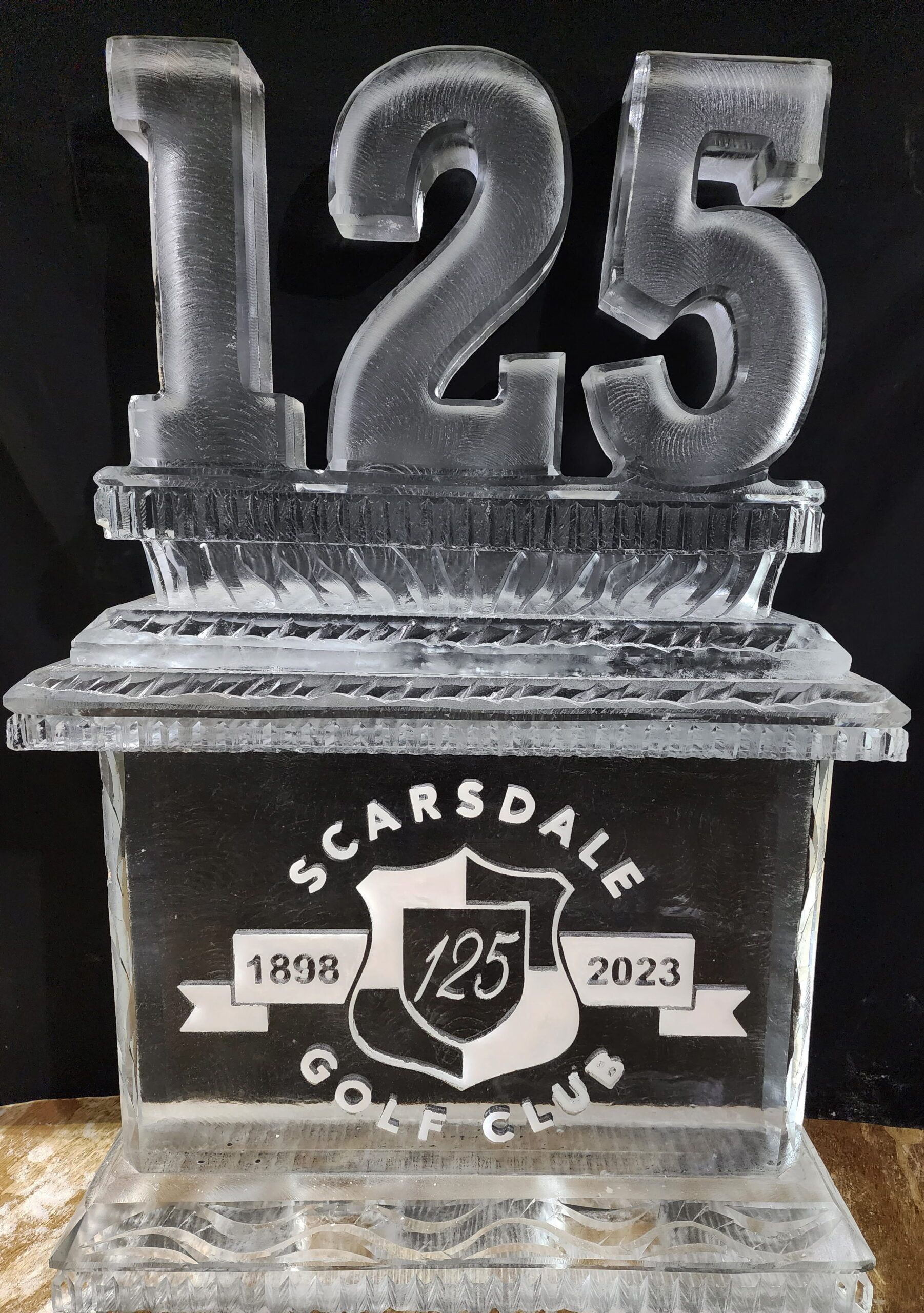 Clear acrylic 125th anniversary trophy with “Scarsdale Golf Club” and 1898–2023 on a black base