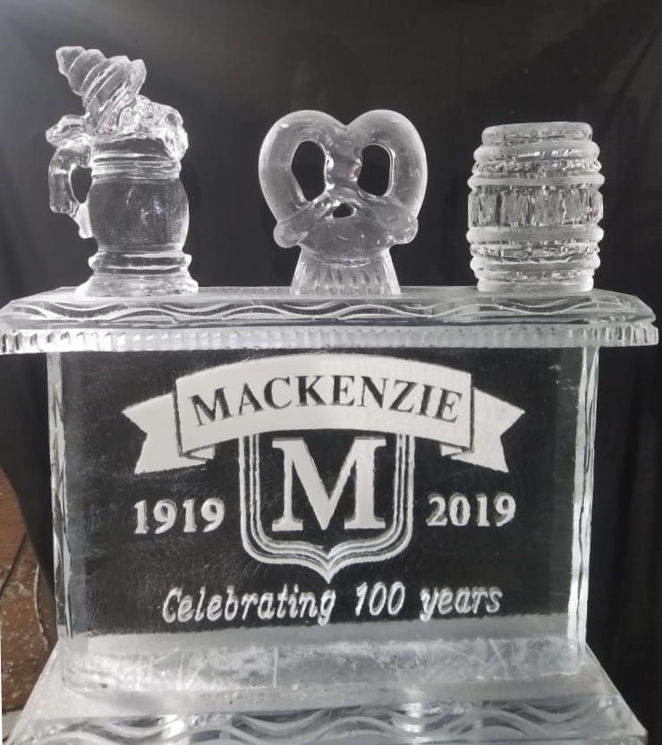 Clear engraved glass award reading “MACKENZIE 1919 2019 Celebrating 100 years”