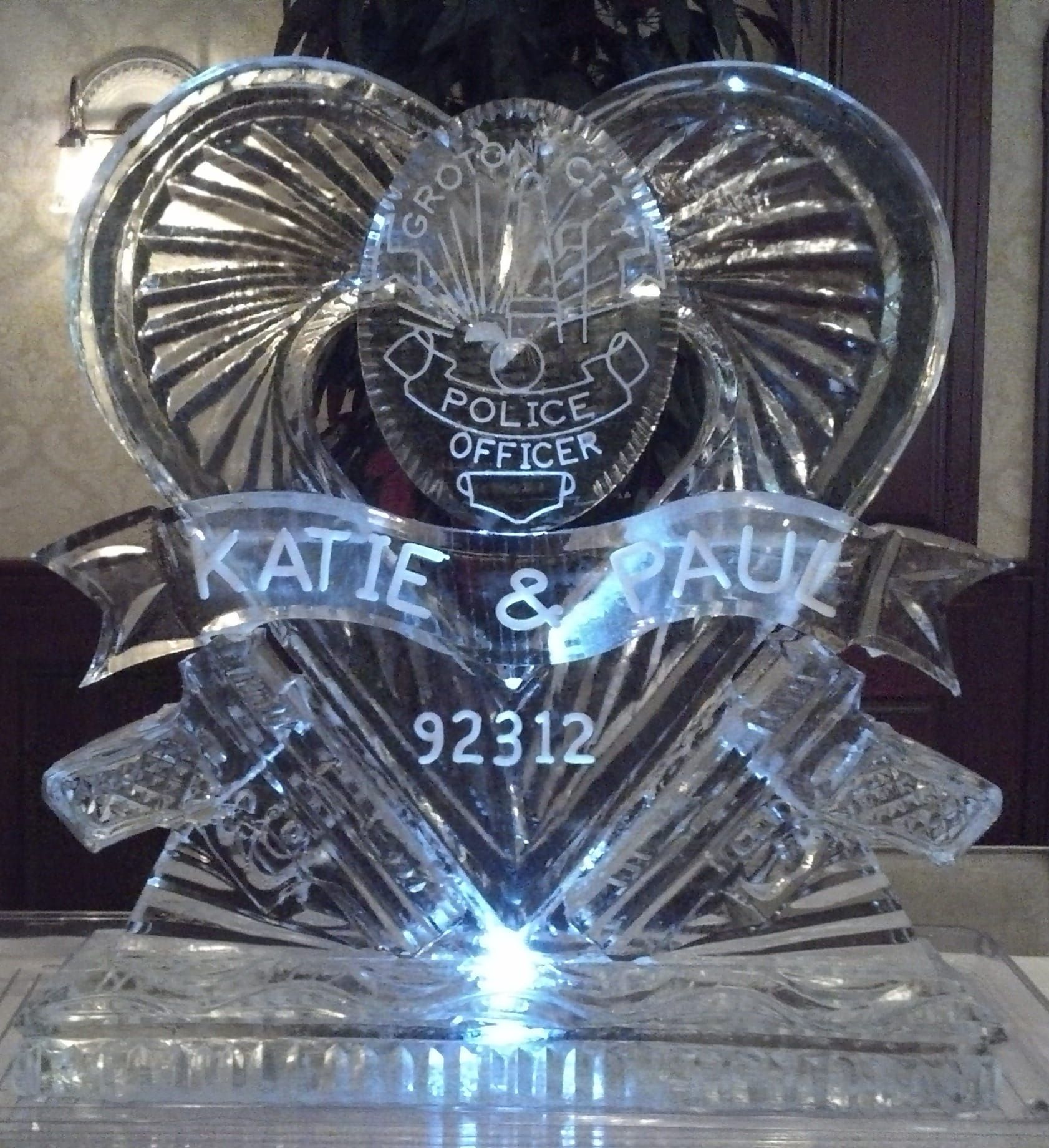 Heart-shaped clear crystal police officer keepsake with “Katie &” and “92312” engraved on a base.