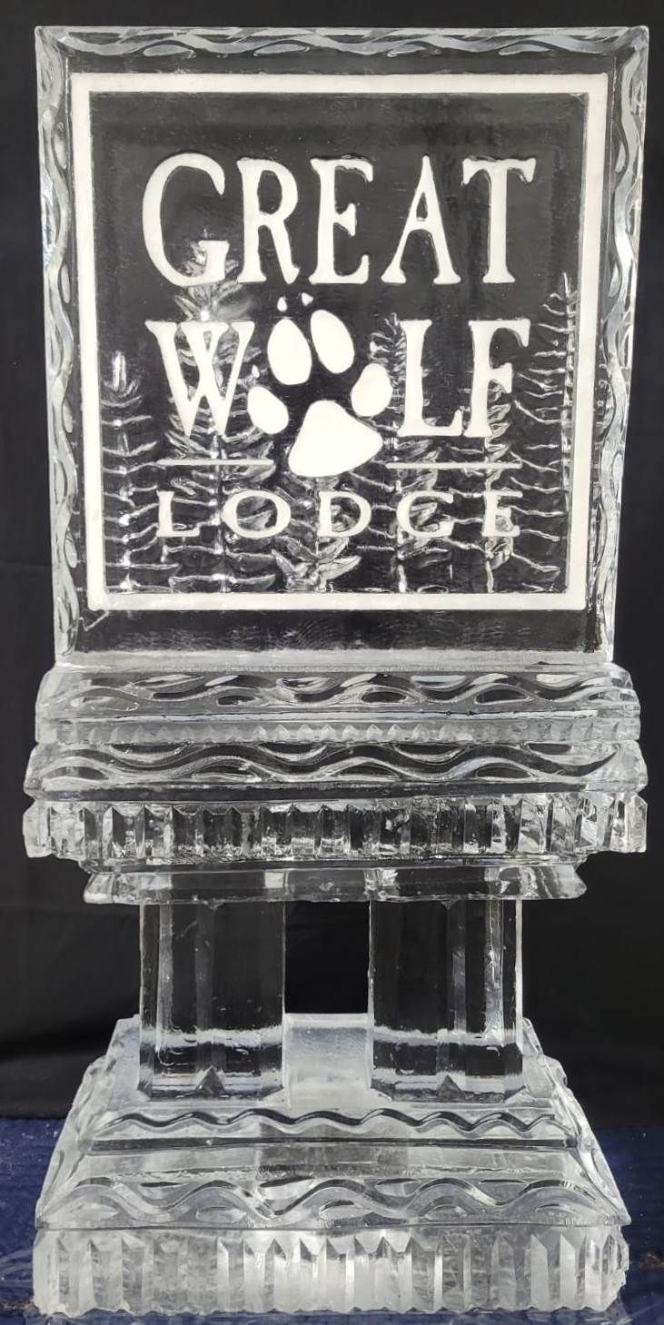 Great Wolf Lodge logo on a decorative sign with a wolf paw print