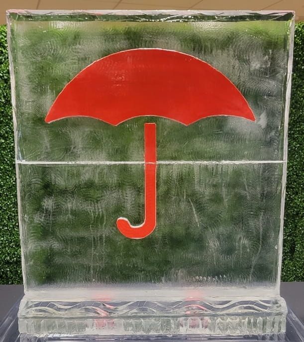 Red umbrella icon with a J-shaped handle embedded in clear ice blocks.