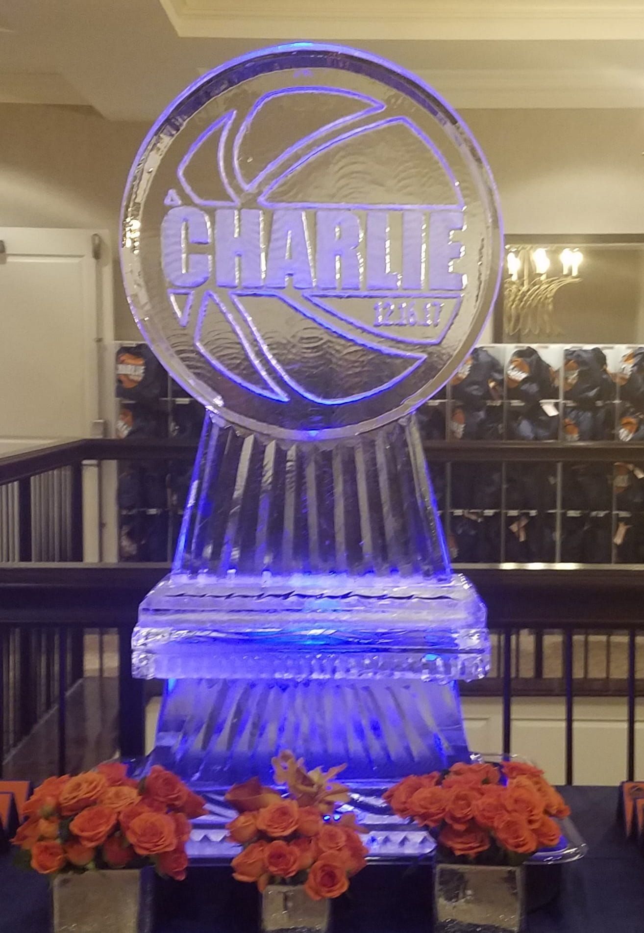 Blue-lit trophy with a circular 