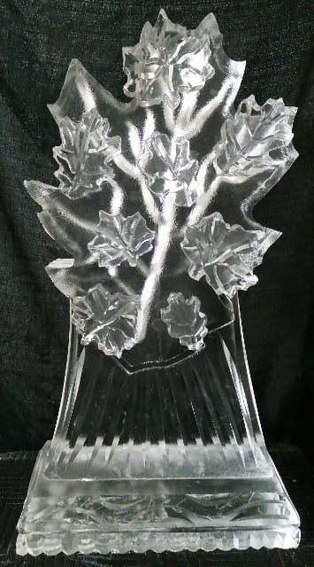 Clear glass crystal sculpture of a flower bouquet on a faceted base