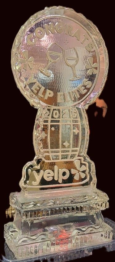 Transparent Yelp trophy with the Yelp logo on a base