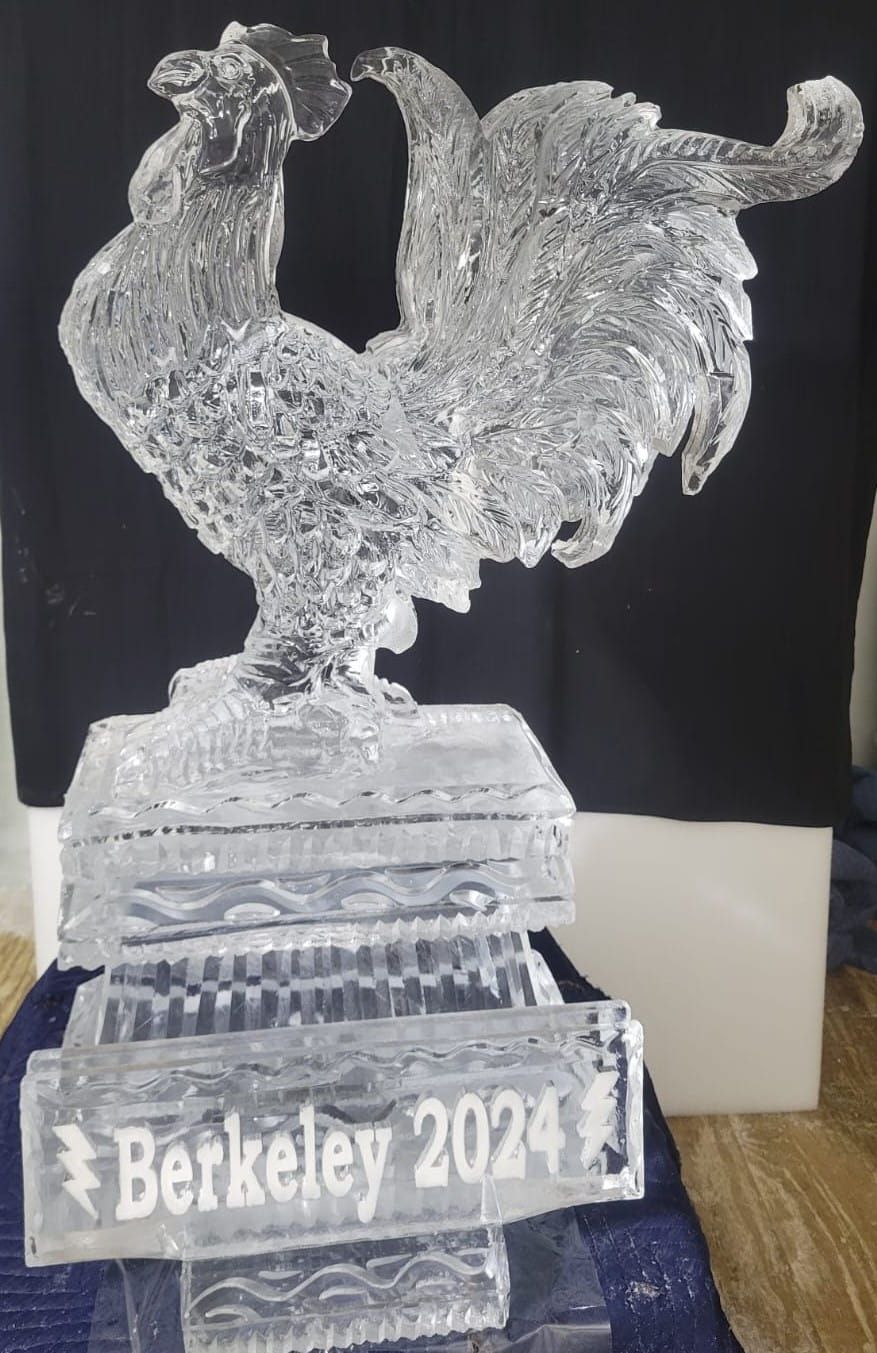 Clear rooster trophy on a base labeled “Berkeley 2024” against a dark background