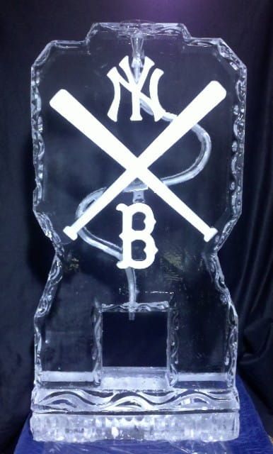 Clear glass award with crossed bats, New York Yankees logo, and a large B on a black background