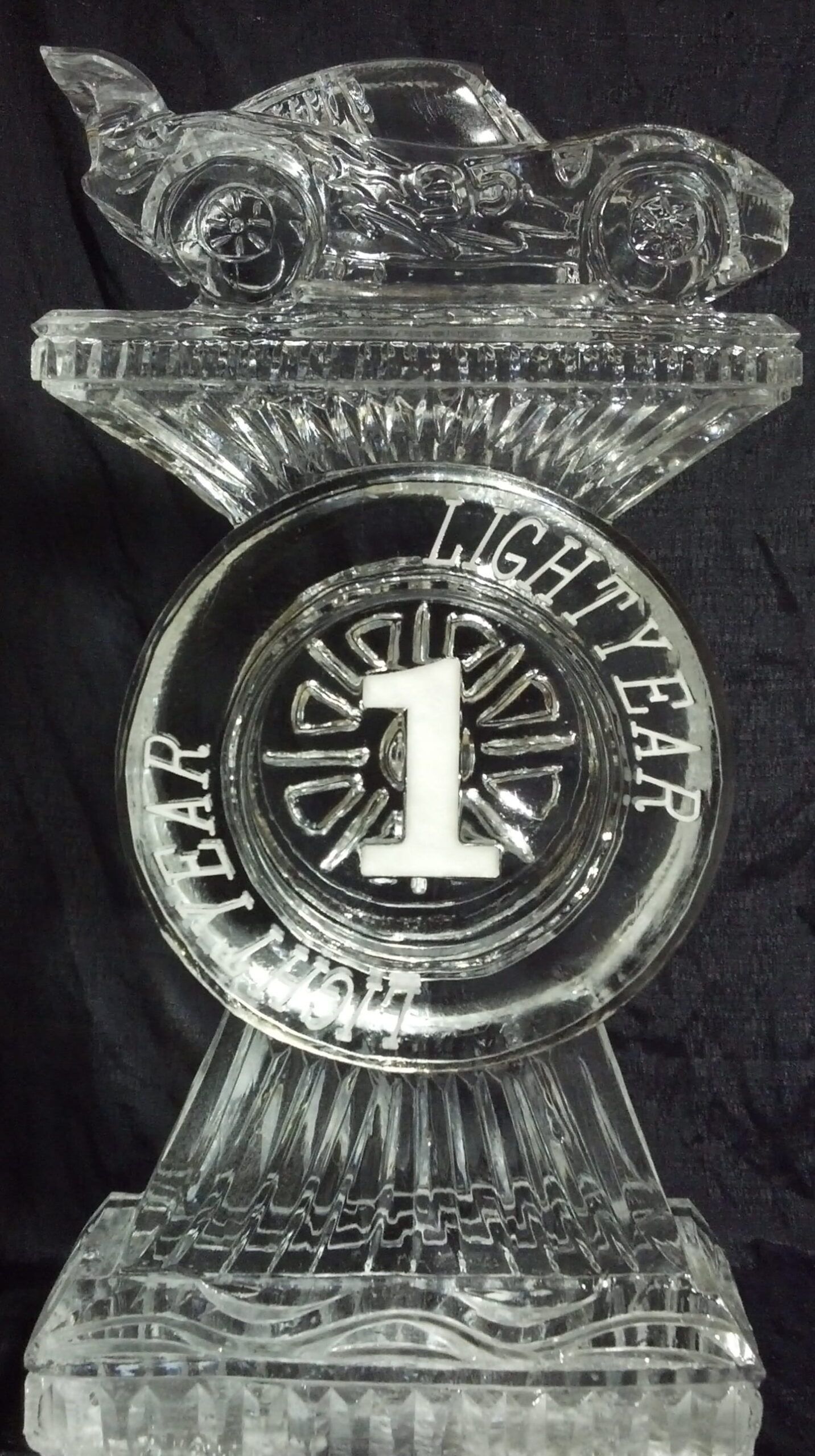 Clear glass trophy with a large number 1 and 