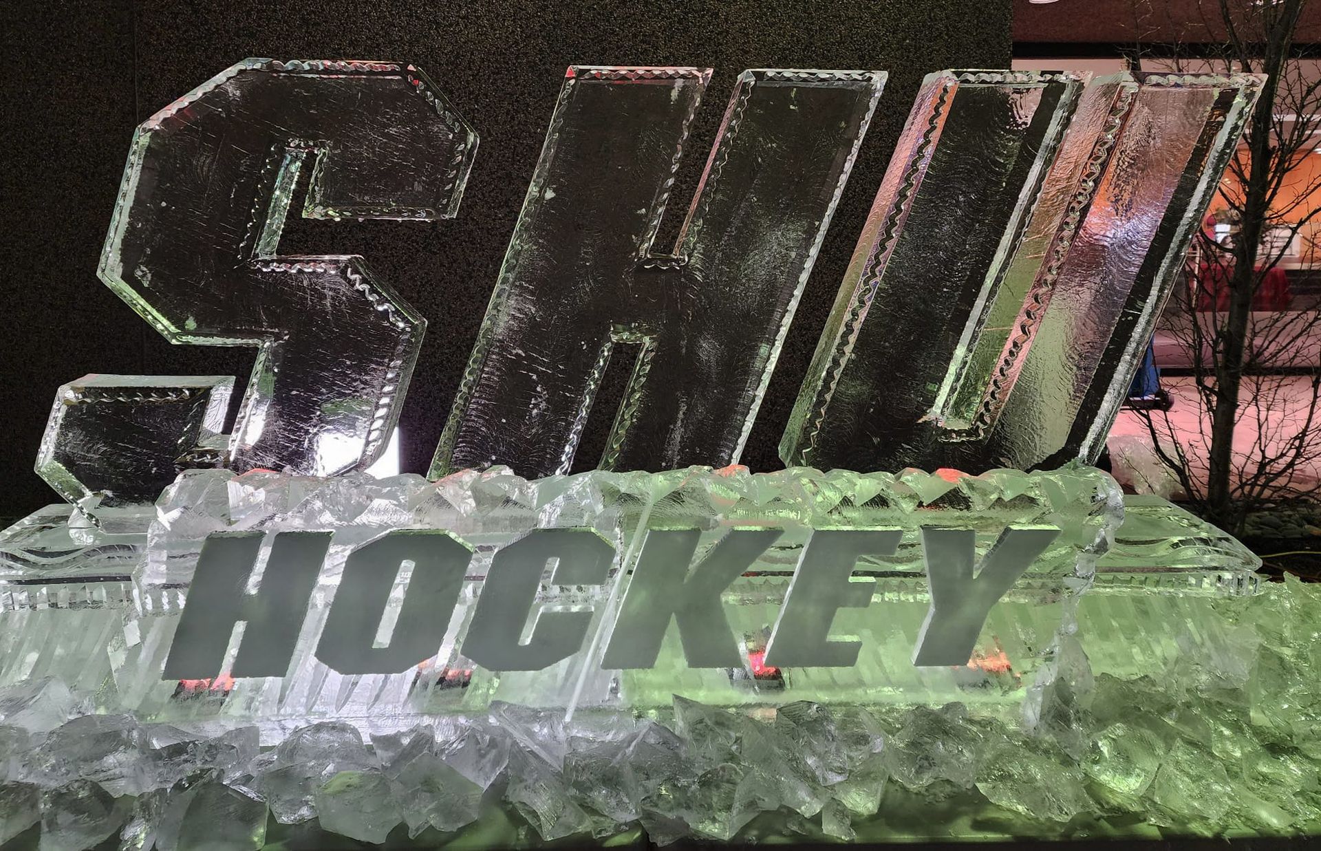 SHU Hockey ice sculpture with clear block letters in an outdoor setting
