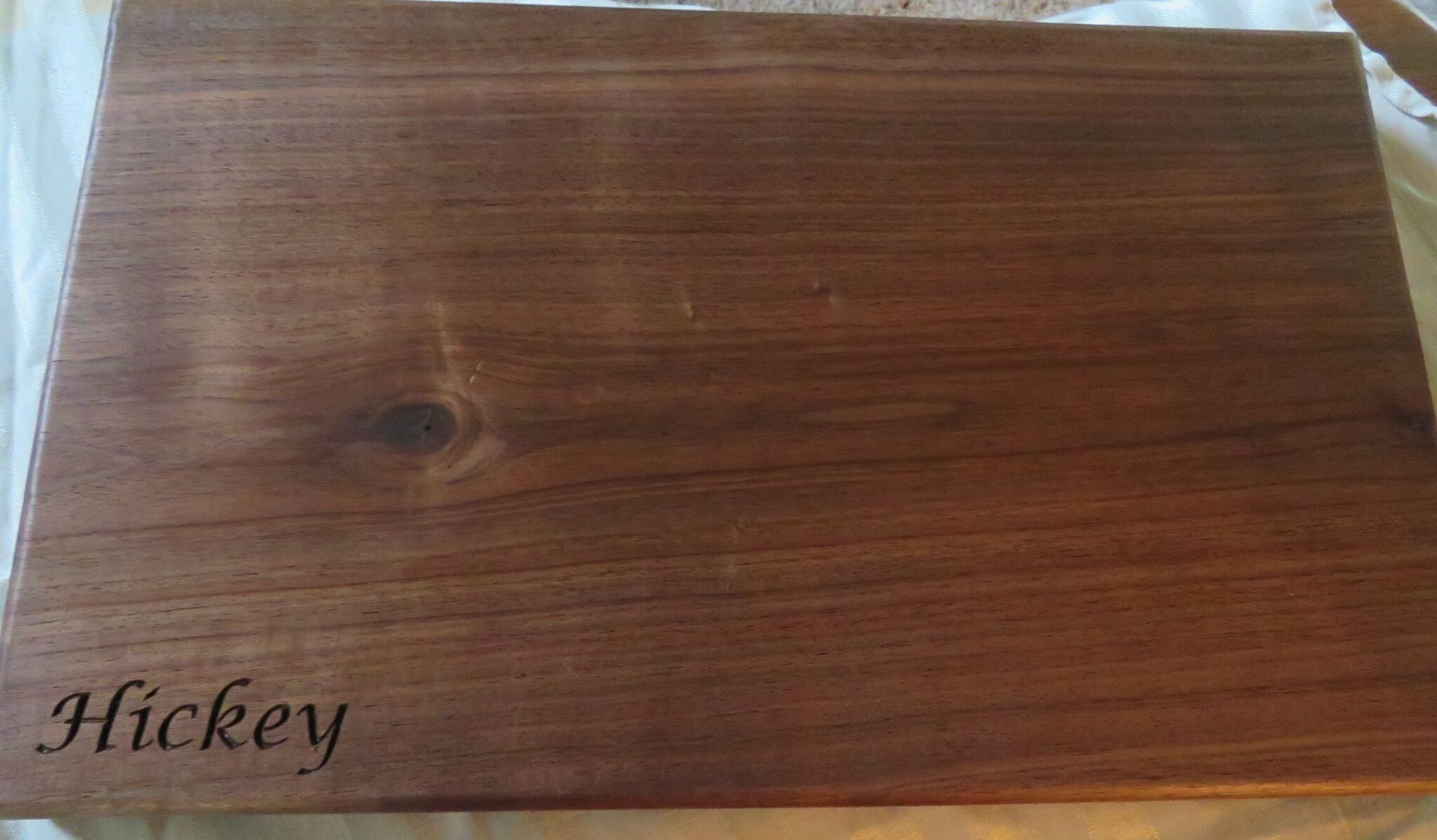 Wood grain sample board with the word “Hickey” printed in the lower left corner.