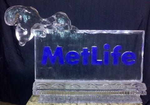 Clear glass MetLife award with blue logo on a black background