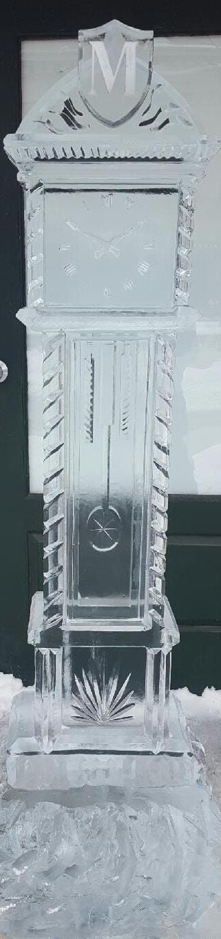 Crystal glass trophy or decorative vase with etched leaf pattern on a clear pedestal, centered against a plain background