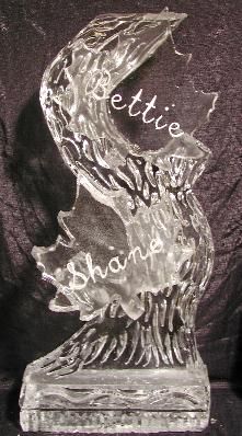 Clear glass trophy with engraved flame shape and the names 