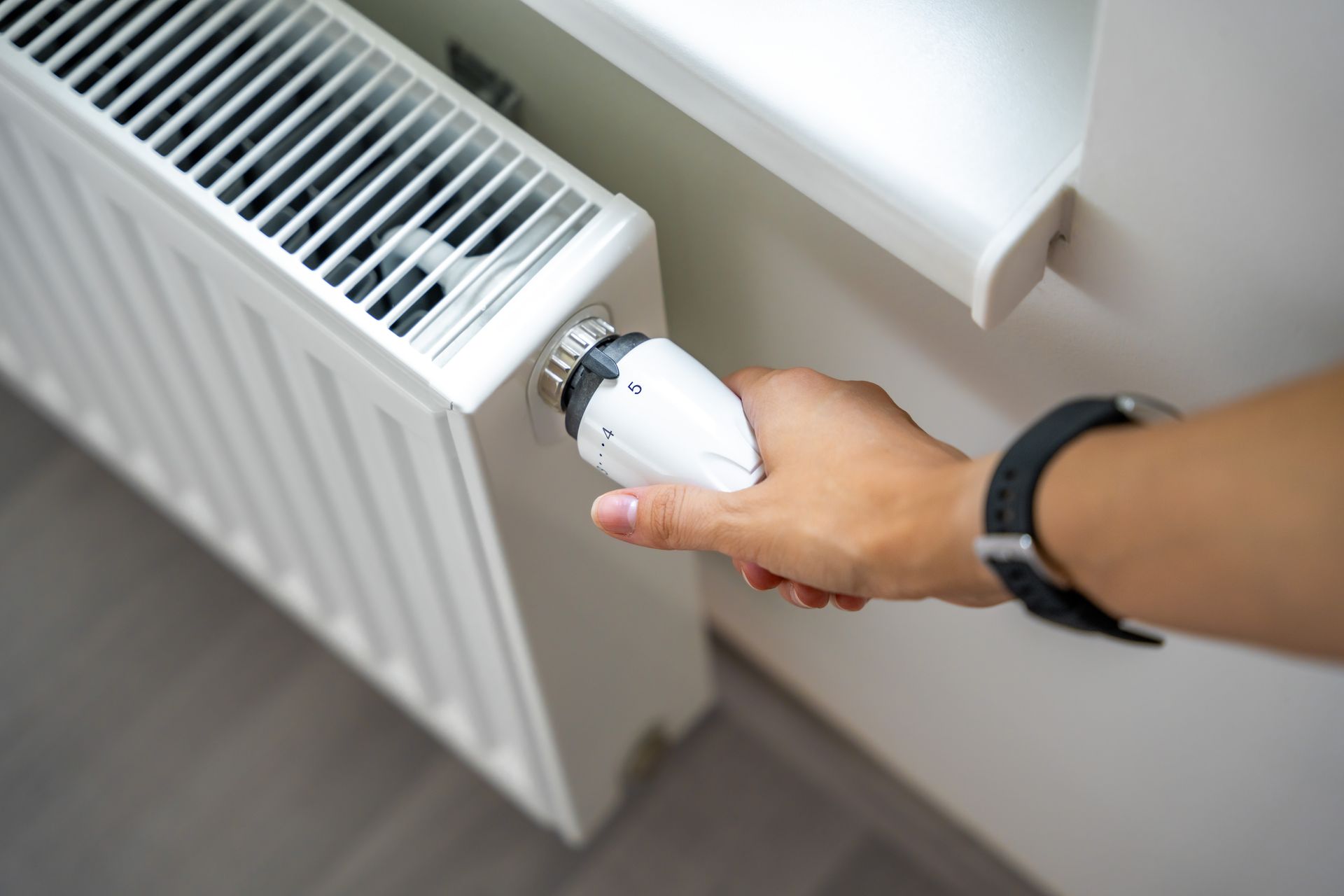 Heating system repair on a home radiator thermostat
