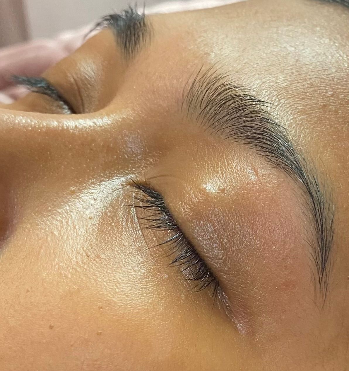 A Woman Wearing a Mask is Applying Makeup to Another Woman's Face — Glam Hair and Beauty in Woy Woy, NSW