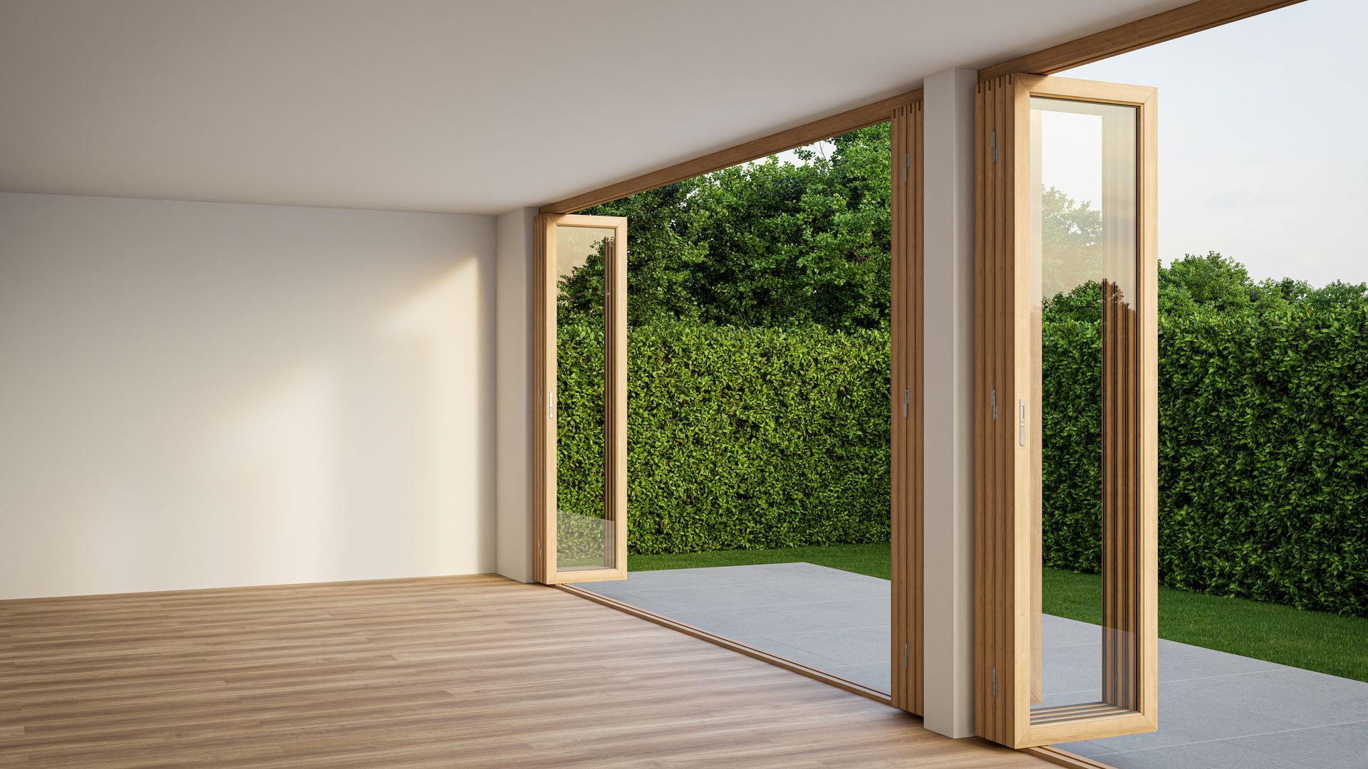 An empty room with sliding glass doors leading to a patio. An empty room with sliding glass doors leading to a patio.