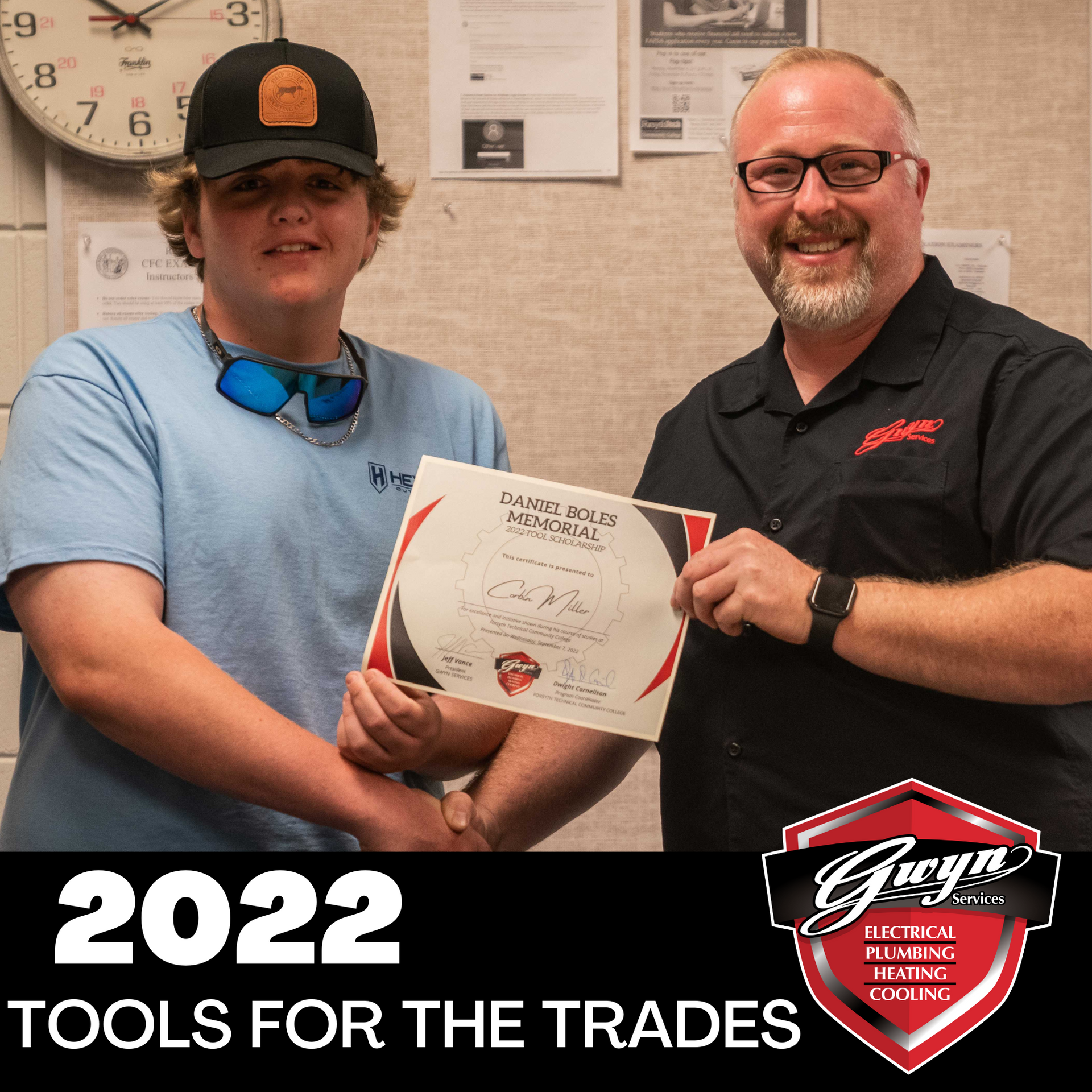 Two people holding a certificate, with “2022 Tools for the Trades” text at the bottom