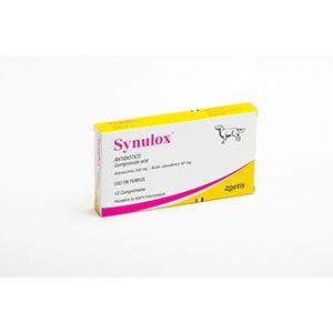 Caja de medicamentos veterinarios Synulox, blanca con detalles en amarillo y rosa, sobre un fondo liso.