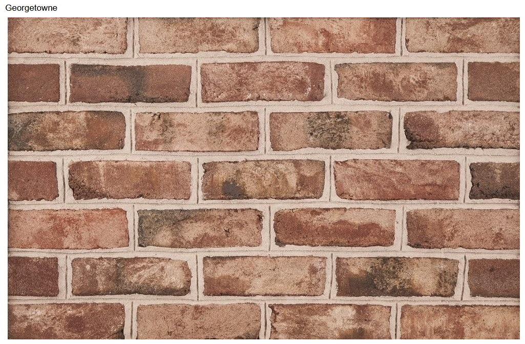 Red brick wall with brown mortar.
