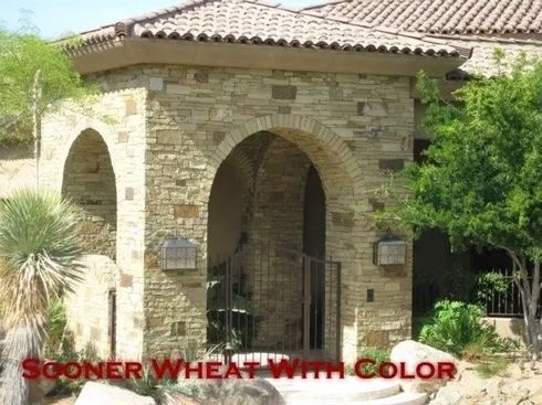 Stone archway entrance with brown tile roof.