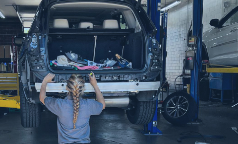 Woman Mechanic Repairing Vehicle in Boulder, CO - J & S Automotive